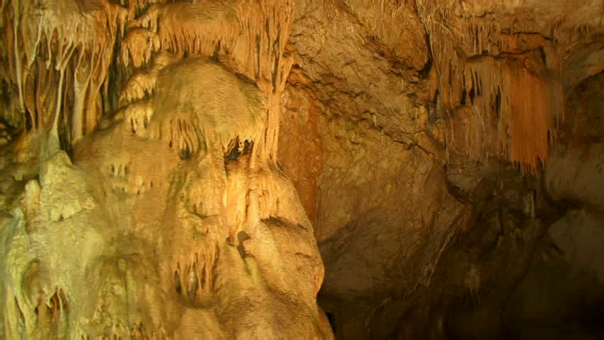 Inside, the deep and ancient caves. Tracking shot.