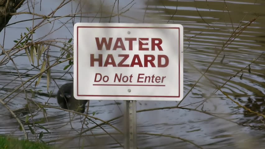Water Hazard Sign On Lake 
