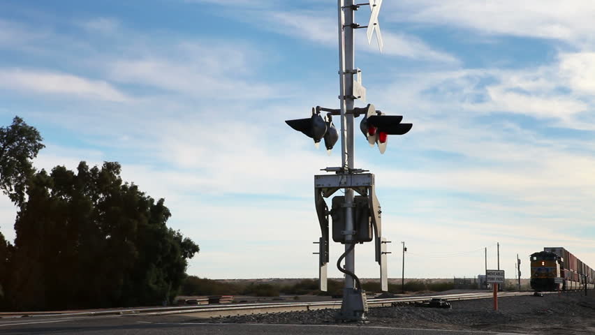 Freight Train Passes Crossing