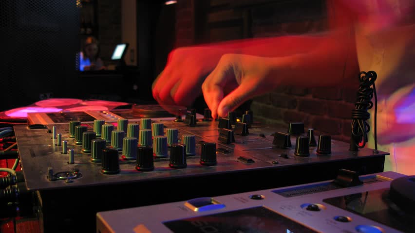 Close-up view on DJ panel during party in nightclub, time lapse