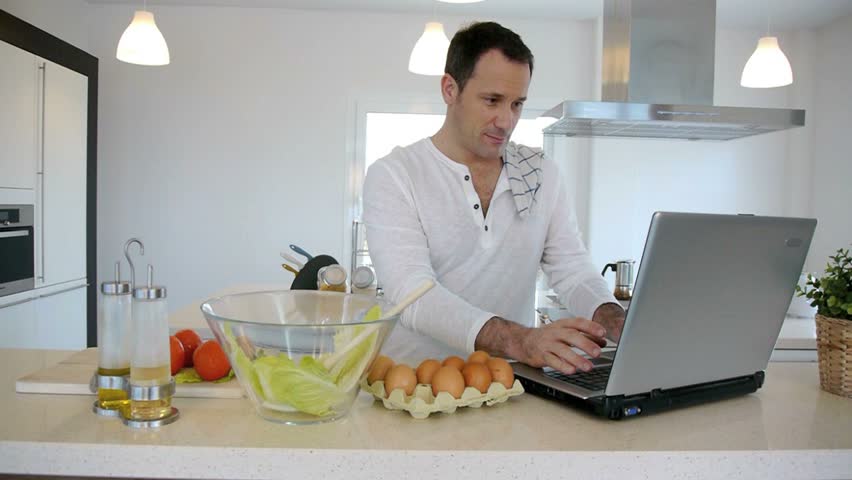 Man checking recipe on internet