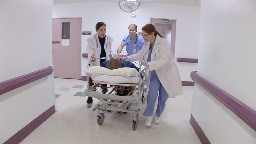 Medical personnel in hospital with patient