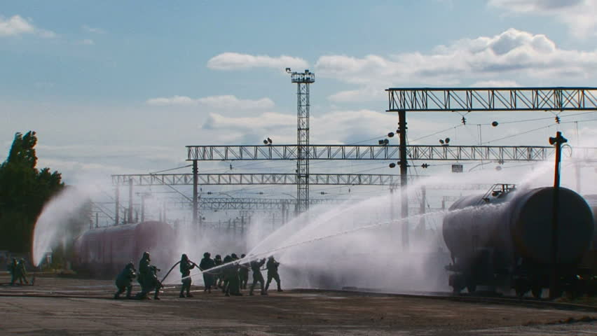 Heroic struggle. Firefighters in protective suits are trying to cope with the effects of chemical disasters.