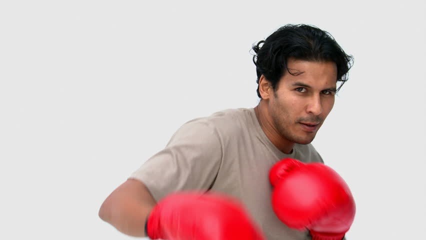 Man with boxing gloves against a white background