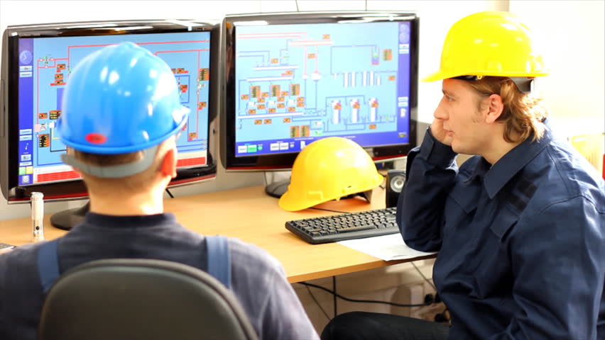 Two Workers in a Control room