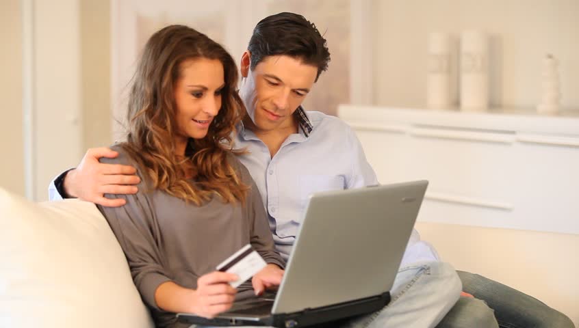 Couple at home doing online shopping 
