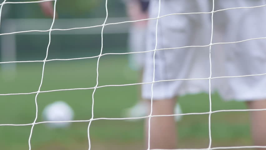 Soccer goal being scored from penalty kick