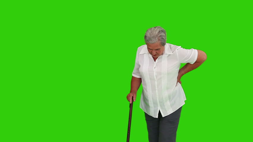 Chromakey footage of a retired woman walking with a stick