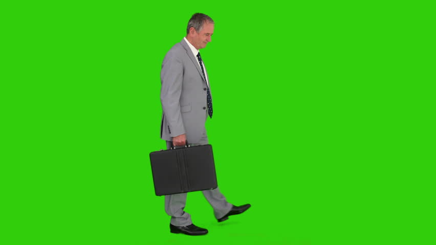 Chromakey footage of a businessman in  a gray suit with a briefcase