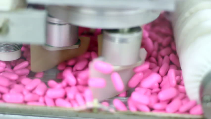 Production line for tablet (pill) sorting and packaging.  HD 1080p.