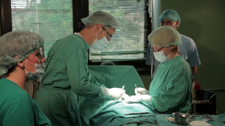 Surgeons Team Performing Surgical Operation, Cesarean Section In ...