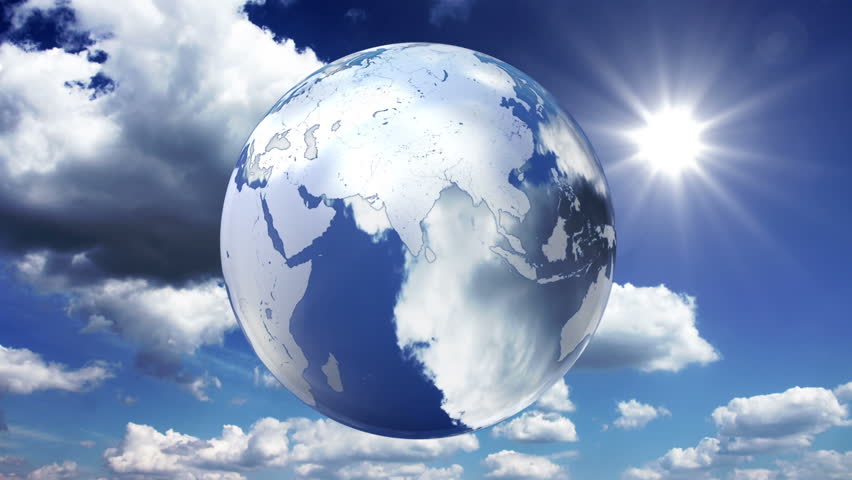Spinning glass planet Earth on sky background - looped animation