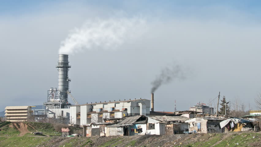 smoking factory chimneys surrounded by poverty. HD 