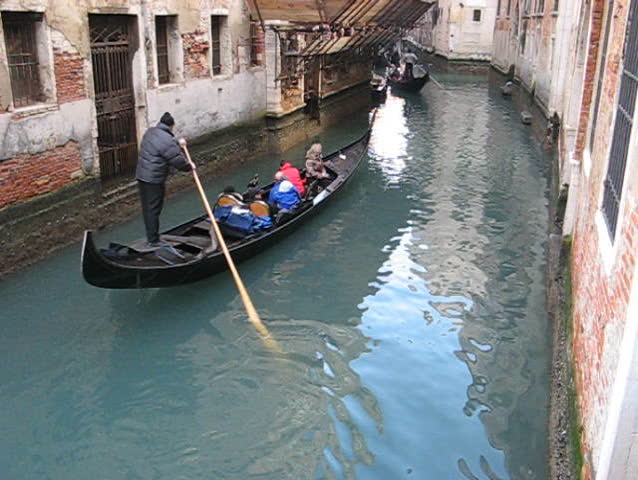 Venice: Gondola passage along an unknown canal
