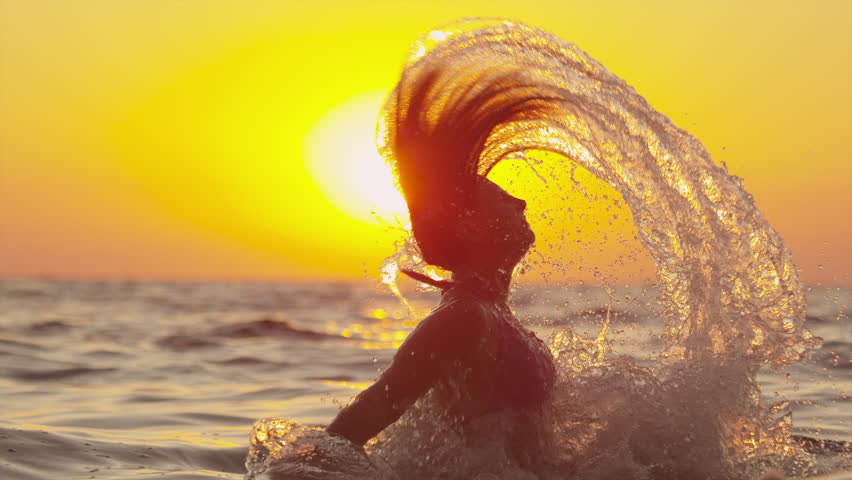 SLOW MOTION: Woman Splashes Water With Her Hair Stock 