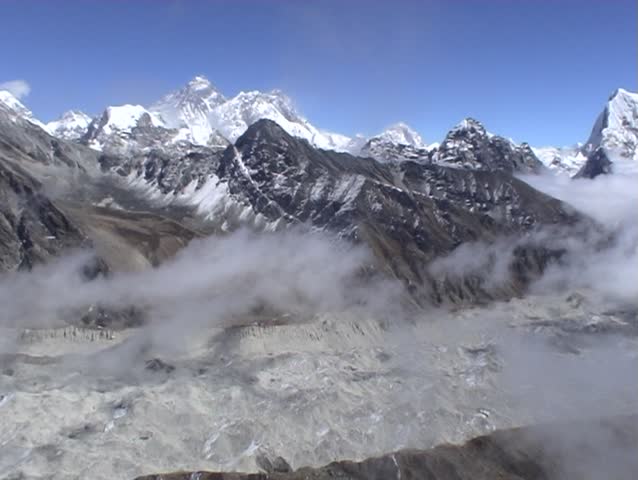 Clouds moving over the glaciated Gokyo valley in Nepal, with mount Everest beyond.