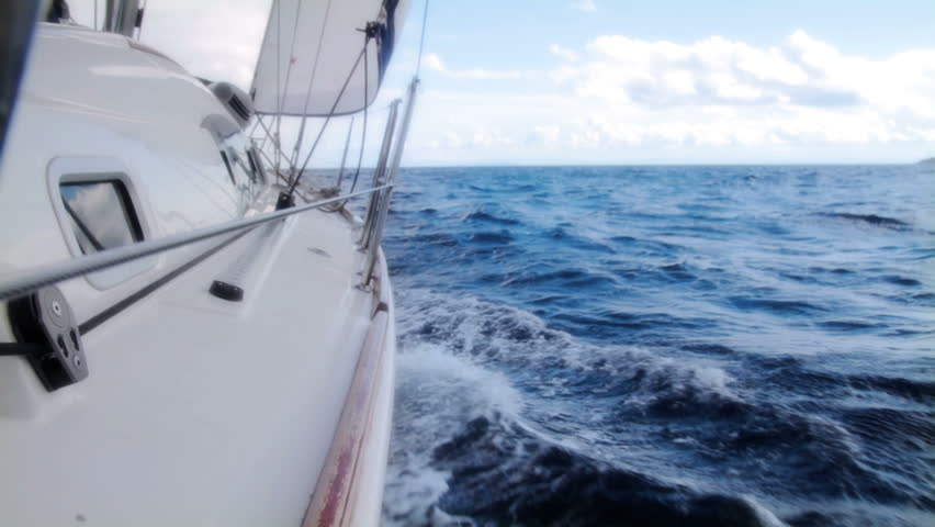 Sailing in the wind through the waves (HD) Sailing boat shot in full HD at the Mediteranean sea in Greece.