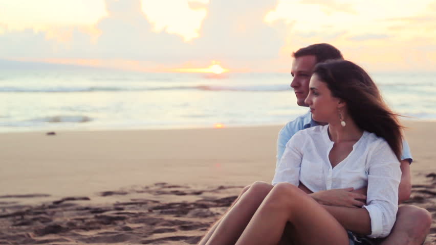 Young Caucasian Couple Kiss On A Vacation Beach At Sunset Stock Footage