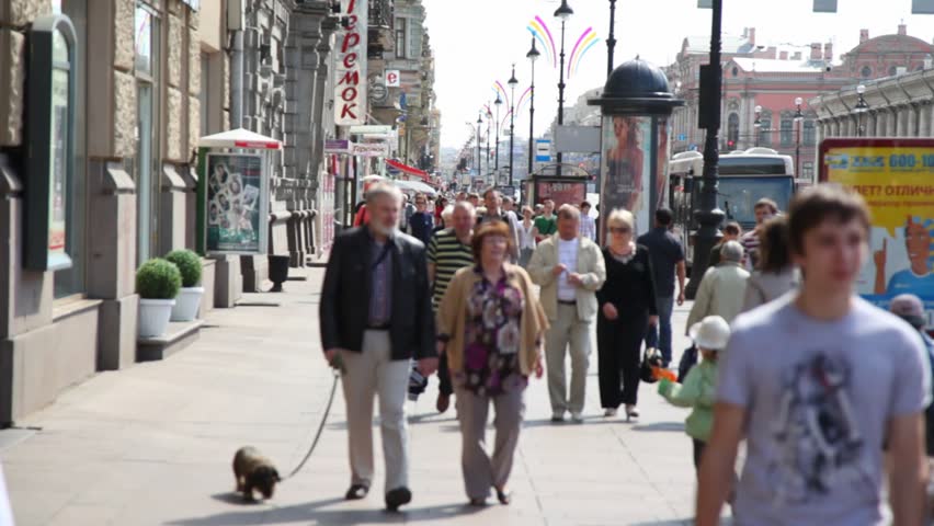 PETERSBURG - MAY 23: People walk on the sidewalk of the Neva prospectus, May 23, 2010 in St. Petersburg, Russia. The Neva prospectus is a historical, business and cultural center of Saint Petersburg.