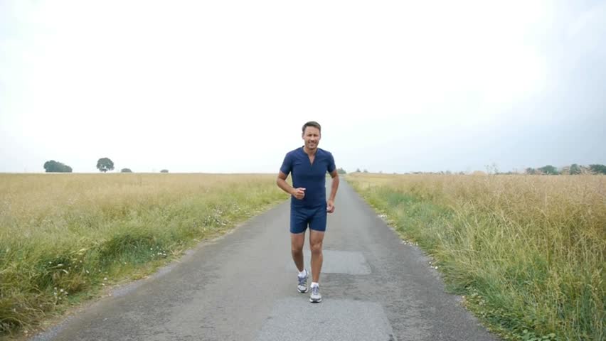 Man jogging on country road