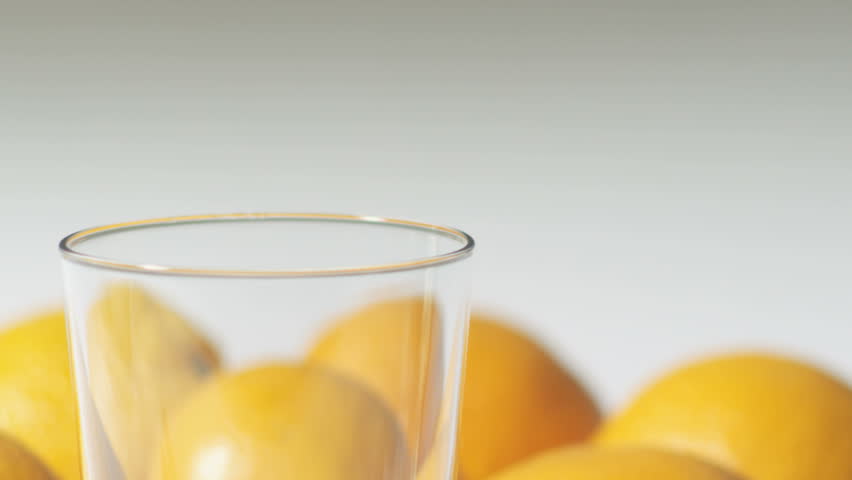 Pouring orange juice. Shot on RED at 100fps. 
