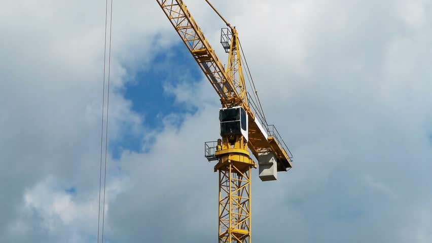 Construction crane against the blue sky