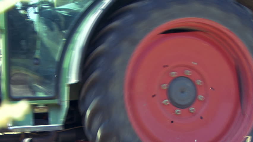 Farmer drives the tractor