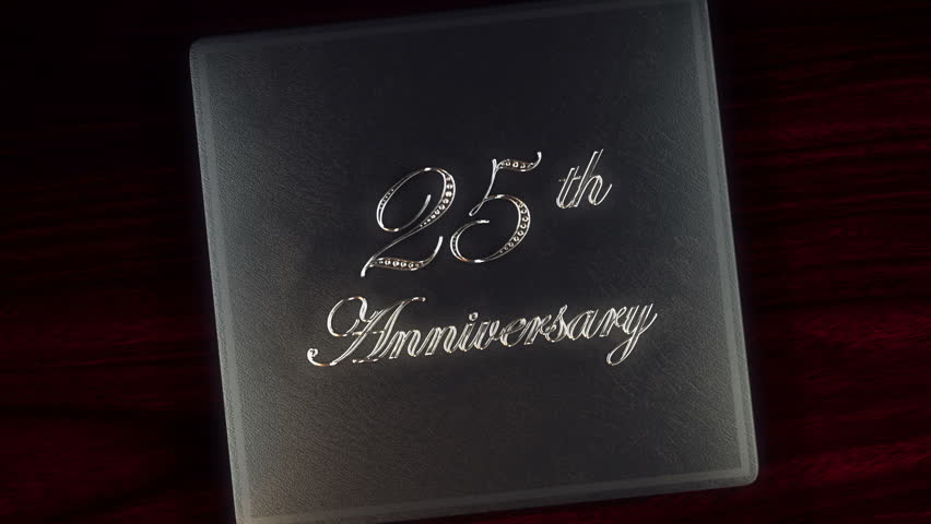 Tell your story with this 25th silver anniversary leather album with diamond inlays that opens and closes with a green screen to insert your picture or footage