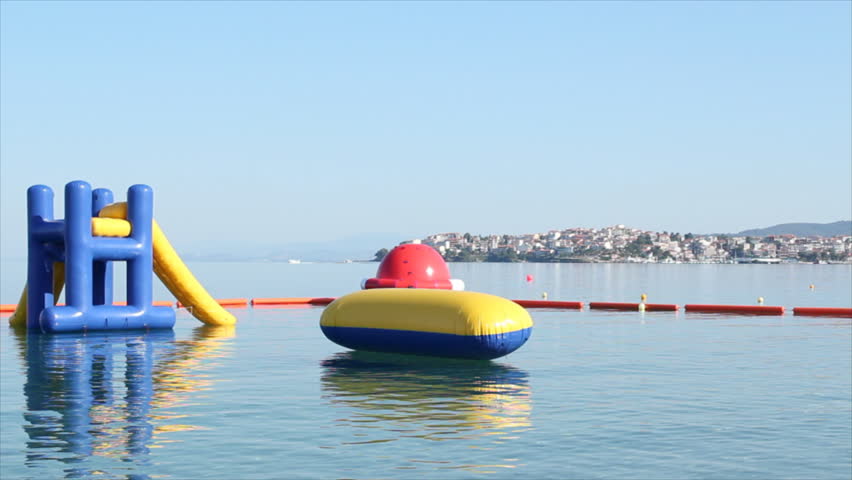 beach toys and equipment for fun floating on sea Neos Marmaras Sithonia Halkidiki Greece