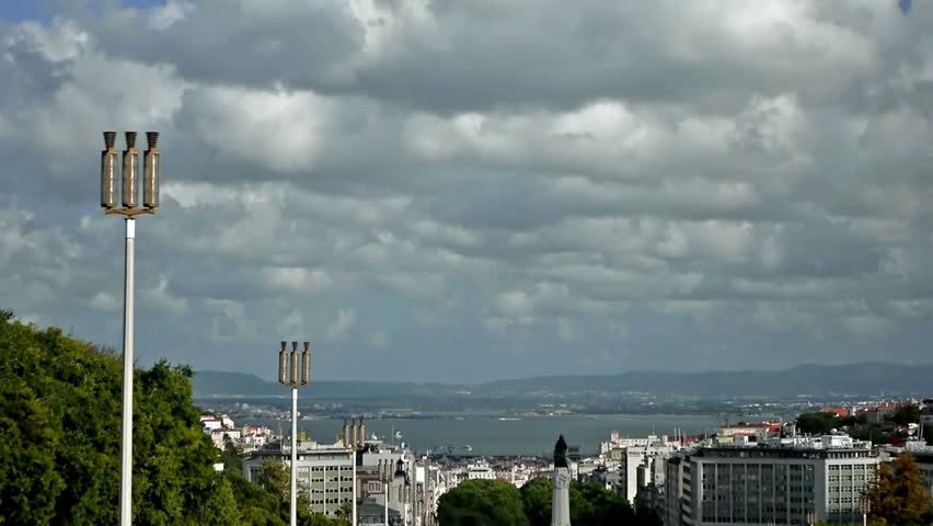 Time-lapse from the top of Lisbon's Eduardo VII Park, high density of clouds moving to the left.
