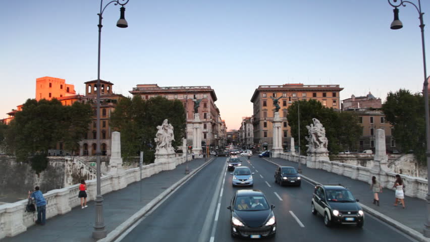 ROME - AUGUST 1: Riding through Ponte Vittorio Emanuele II Bridge across Tiber, August 1, 2010 in Rome, Italy. Ponte Vittorio Emanuele II Bridge  connects historic centre of Rome with Rione Borgo and Vatican City. 