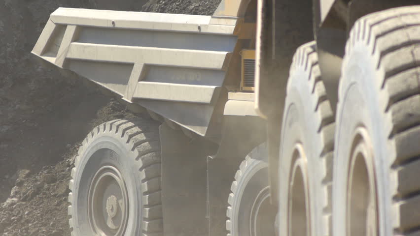 Mining dump trucks in the open pit mine
