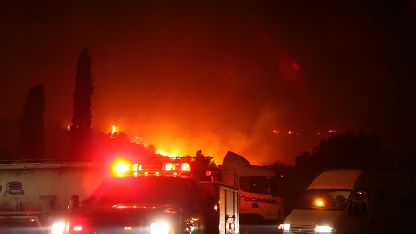 TIRAH, ISRAEL - DECEMBER 2: Fire trucks and tankers at work during Mount Carmel fire, December 2, 2010, Tirah, Israel. The 2010 Mount Carmel forest fire began at 11:00 local time on December 2, 2010 and caused severe property and ecological damage. 