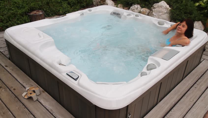 A woman relaxes in the Jacuzzi