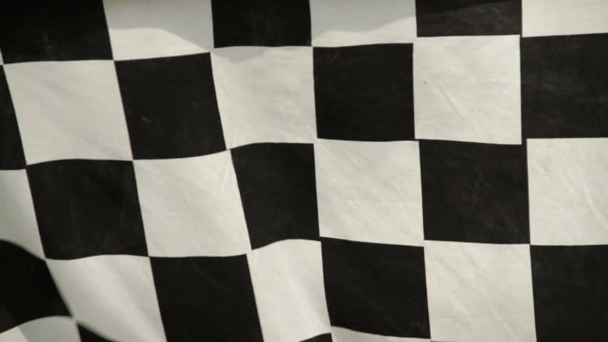 Racing checkered flag in the wind. Real fabric not rendered