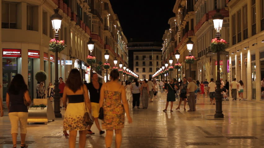 MALAGA - JUNE 18: People walk along the emblematic pedestrian boulevard Calle Marques de Larios at night on June 18, 2011 in Malaga, Spain.