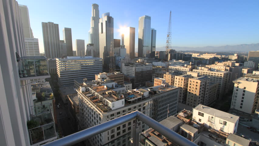 Gorgeous Forward-Sliding Timelapse above Balcony Railing onto Downtown Los Angeles during Nightfall (camera slides forward for the first 9 seconds then stays steady)