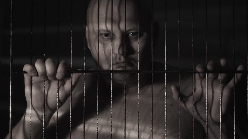 Prisoner in jail cell
