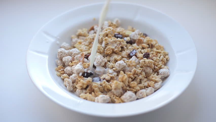 Pouring Milk Into Bowl With Muesli Stock Footage Video 2979178