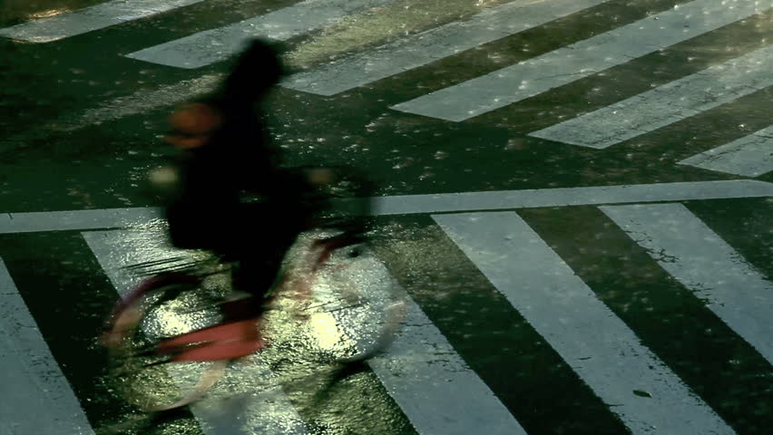 Crosswalk on a street in Tokyo during a typhoon.