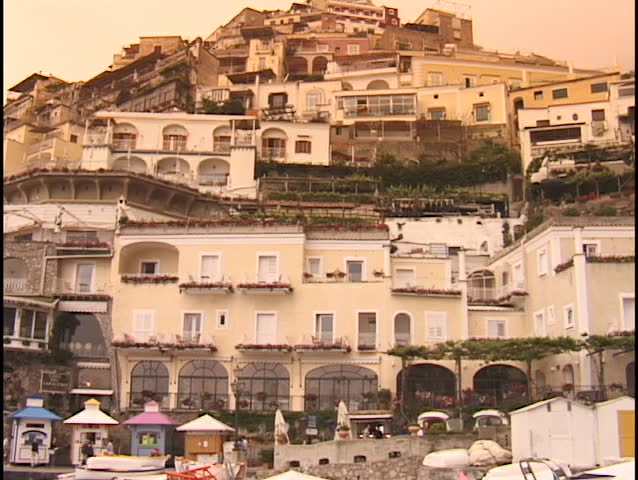 Houses cling to a hillside in Positano, Sicily.