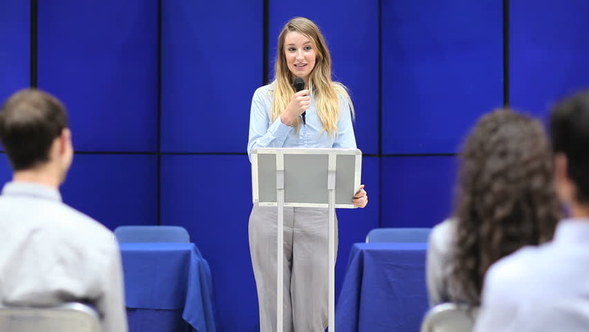 Student making a presentation in an amphitheater