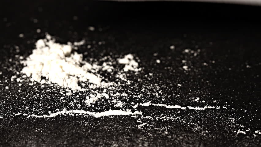 Hard drug - addiction concept. ILLUSTRATION! The white powder is flour before anyone think something else :-)  Studio setup with professional lighting and dolly motion.