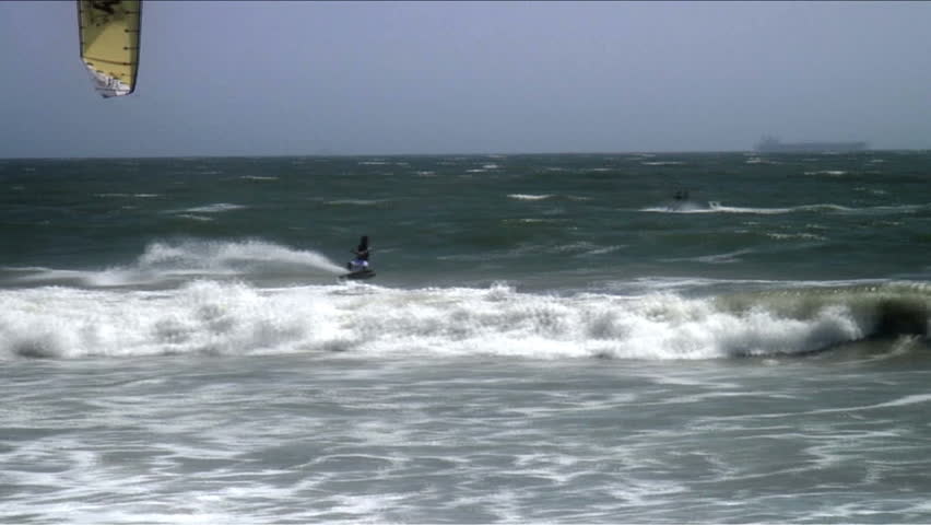 Kiteboarder does a flip
