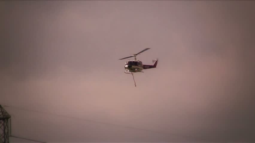 Fire Dept helicopter dropping water