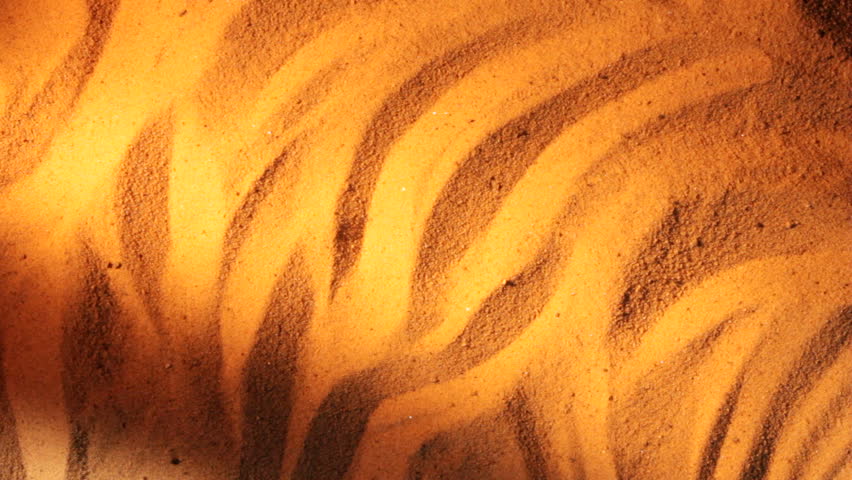 A sand storm blows the dunes away