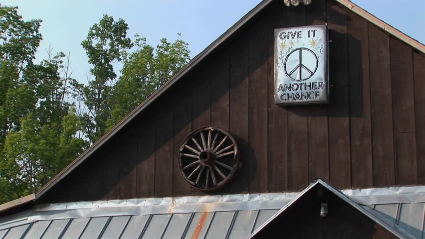 A brown barn with a peace sign in Woodstock, New York.