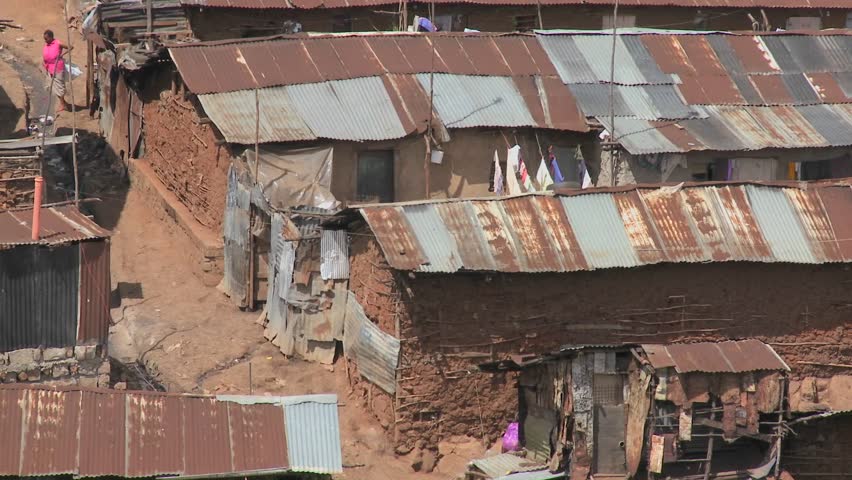 Zoom out from a poverty stricken slum on the outskirts of Nairobi, Kenya.