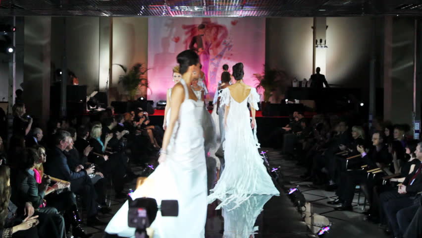 MOSCOW - FEBRUARY 14: Models in white wedding dresses walk catwalk at Evening of French fashion in salon Estet, on February 14, 2011 in Moscow, Russia. 