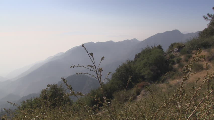 Panning shot from right to left atop Mount Wilson showing smog. 
